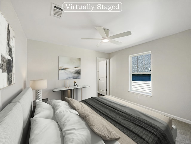 bedroom with ceiling fan and carpet floors