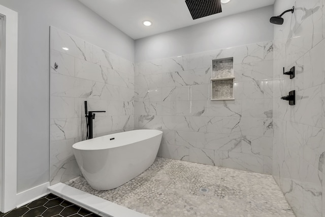 bathroom with plus walk in shower, tile walls, and tile patterned flooring