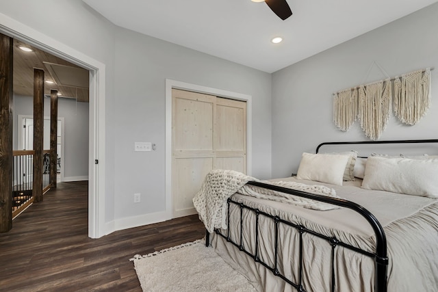 bedroom featuring a closet, ceiling fan, and dark hardwood / wood-style flooring