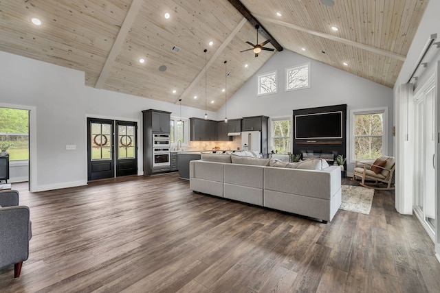 living room with ceiling fan, dark hardwood / wood-style floors, high vaulted ceiling, and wooden ceiling