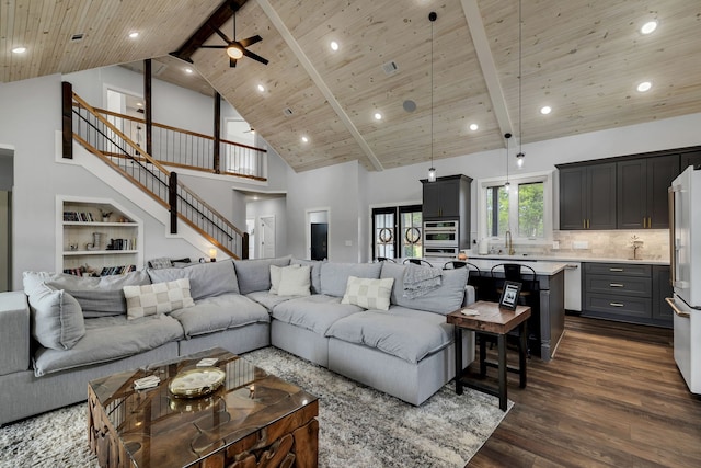 living room featuring beamed ceiling, sink, high vaulted ceiling, dark hardwood / wood-style flooring, and wooden ceiling