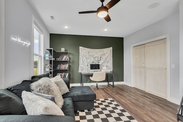 living room with hardwood / wood-style floors and ceiling fan