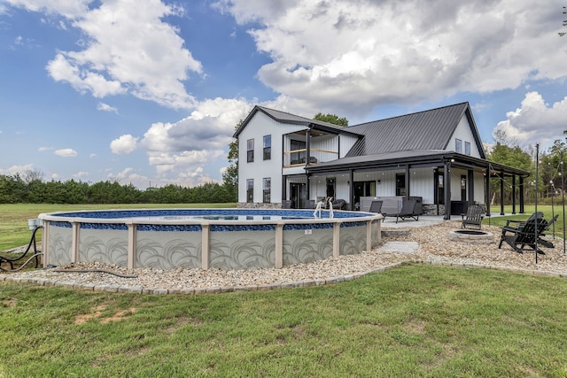 view of pool with a yard and a patio area