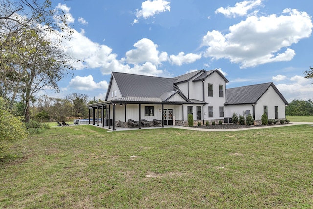 view of front of property with central AC, a front yard, and a porch