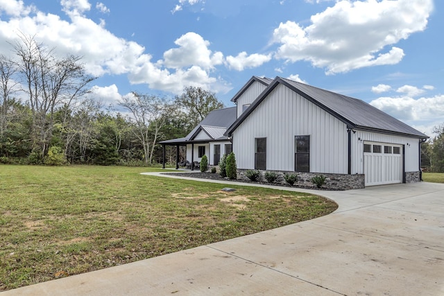 view of side of home featuring a lawn and a garage