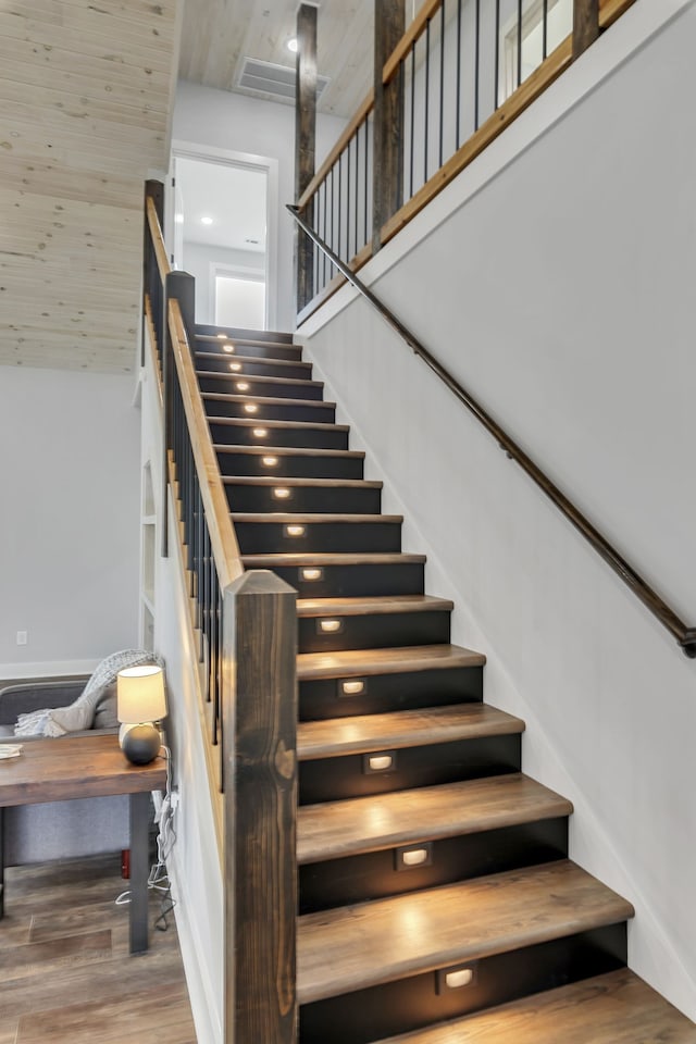 staircase featuring wood-type flooring