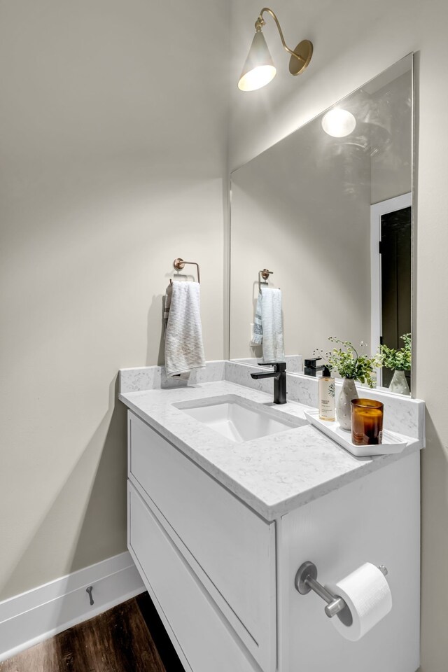 bathroom with vanity and hardwood / wood-style floors