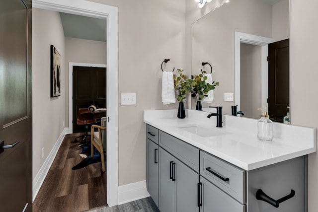 bathroom featuring vanity and hardwood / wood-style floors