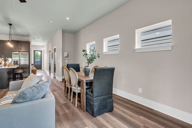 dining room featuring wood-type flooring and ceiling fan