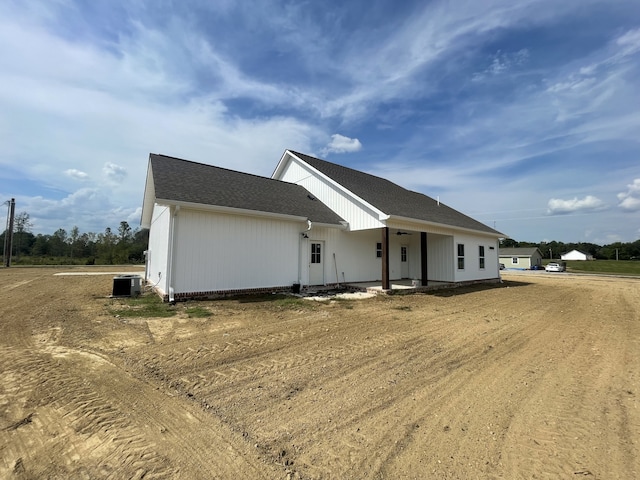 view of front of home featuring covered porch and central air condition unit