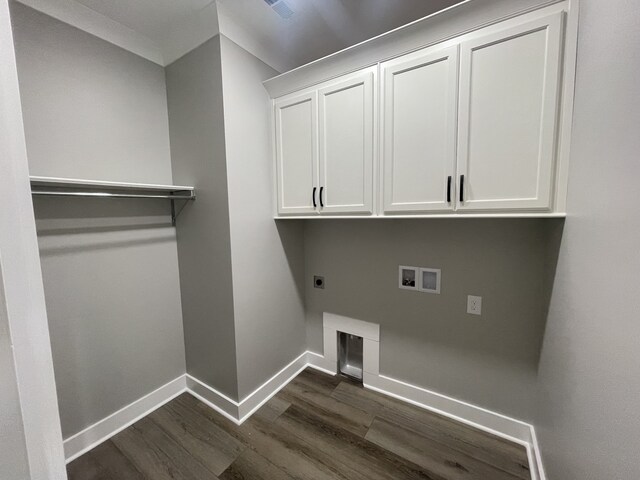 clothes washing area featuring hookup for a washing machine, hookup for an electric dryer, dark wood-type flooring, and cabinets