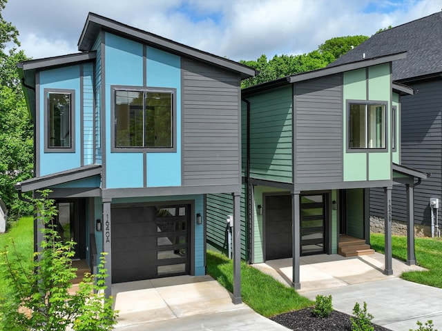 contemporary home featuring driveway and an attached garage