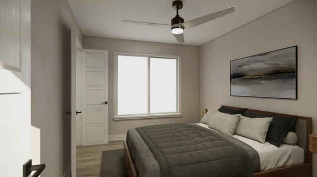 bedroom featuring light wood finished floors, ceiling fan, and baseboards