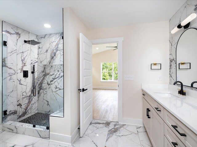 full bathroom with marble finish floor, a marble finish shower, recessed lighting, vanity, and baseboards