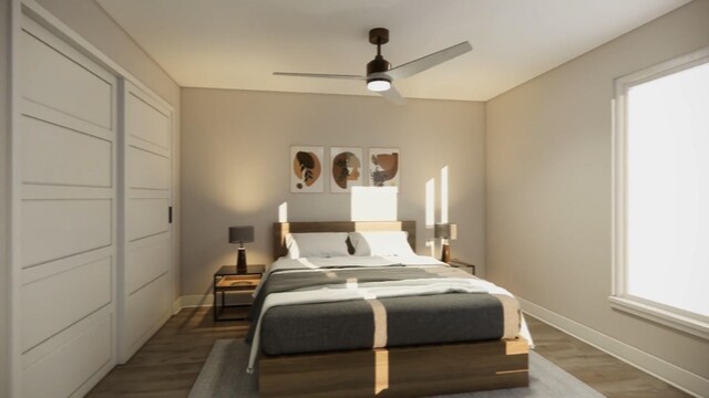 bedroom featuring a ceiling fan, baseboards, and wood finished floors