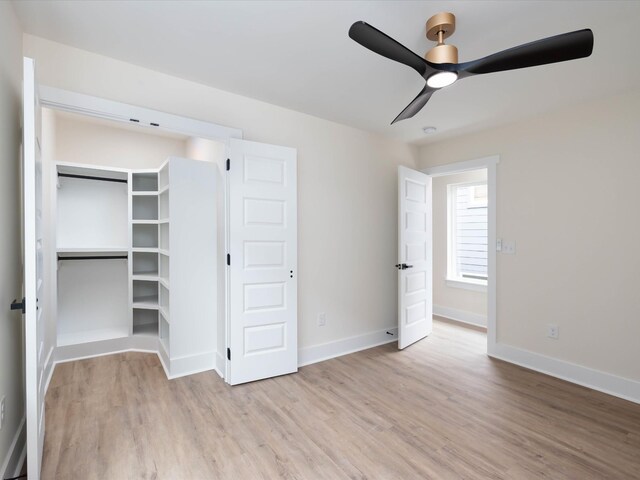 unfurnished bedroom featuring light wood finished floors, ceiling fan, and baseboards