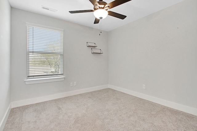 unfurnished room featuring ceiling fan and light colored carpet