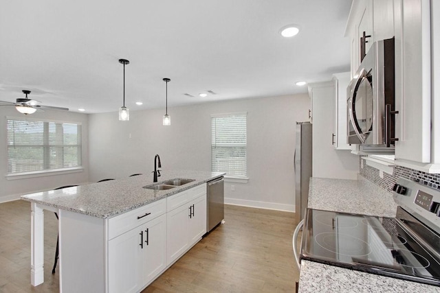 202 Summit St, Woodbury, TN 37190 - kitchen with baseboards, appliances with stainless steel finishes, a sink, and plenty of natural light