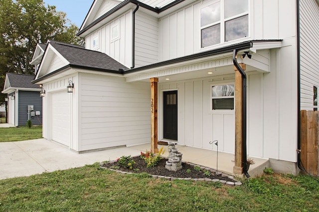 exterior space with a lawn, a porch, and a garage