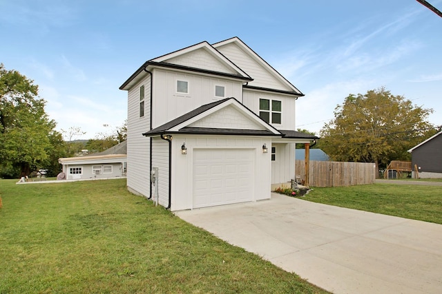 view of front of house featuring a garage and a front lawn