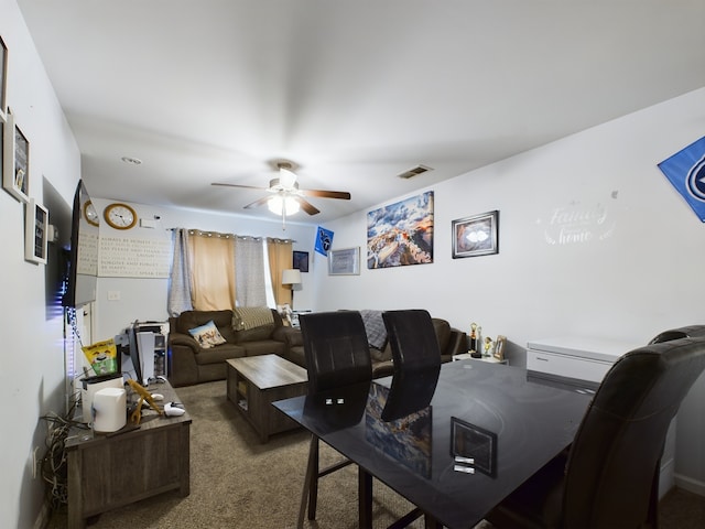 living room with ceiling fan and carpet floors