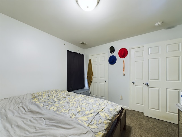 bedroom with dark carpet