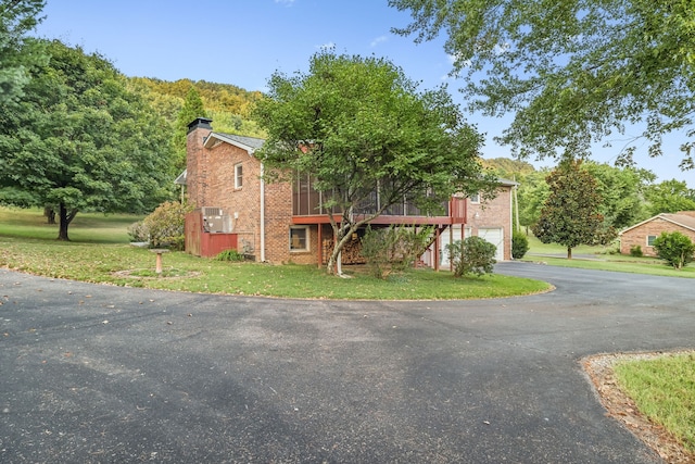 view of front of property with a front lawn and a deck