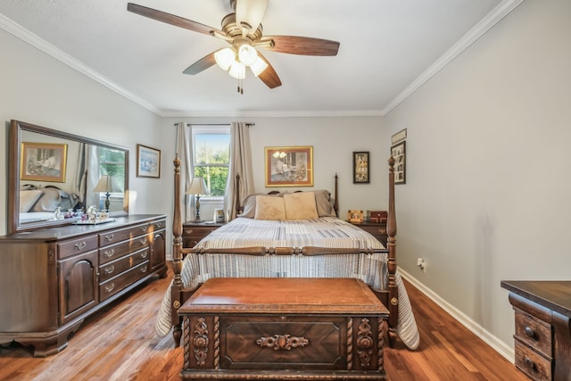 bedroom featuring ceiling fan, hardwood / wood-style flooring, and crown molding