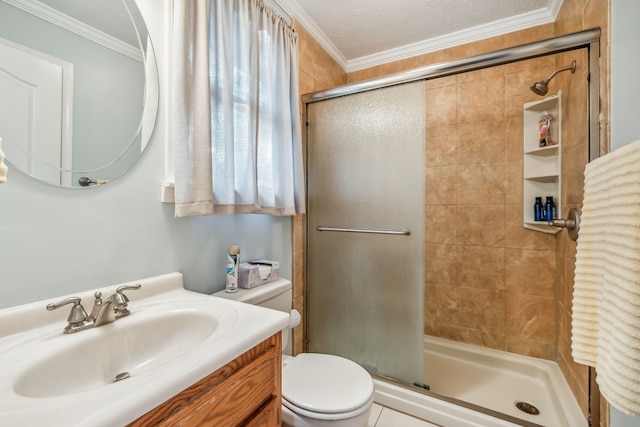 bathroom with vanity, a textured ceiling, a shower with shower door, crown molding, and toilet