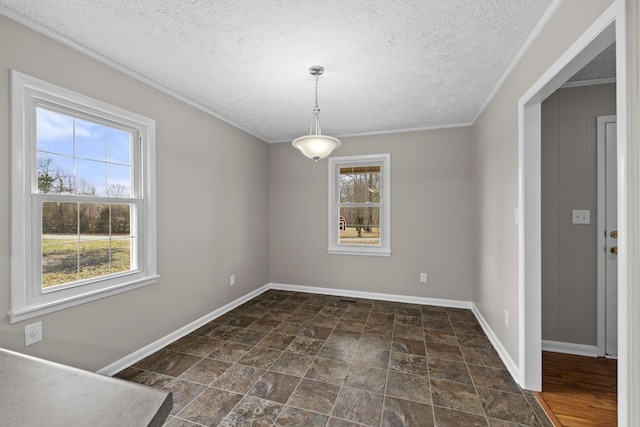 unfurnished dining area featuring a healthy amount of sunlight and a textured ceiling