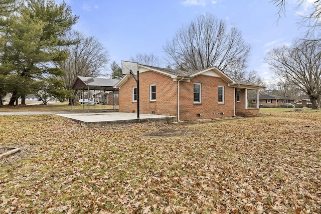 view of side of property featuring a carport