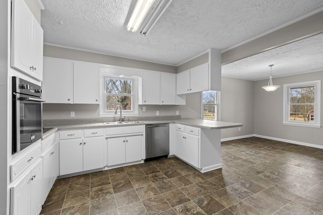 kitchen featuring pendant lighting, sink, stainless steel appliances, white cabinets, and kitchen peninsula