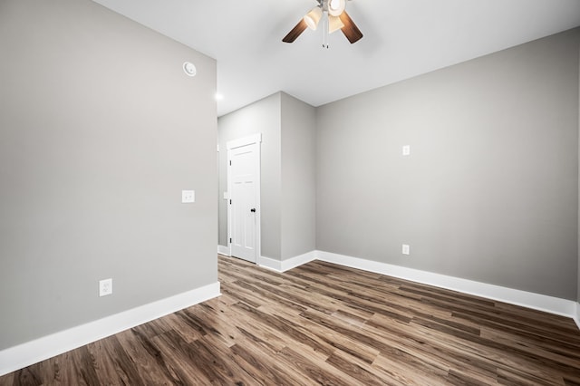 empty room with hardwood / wood-style flooring and ceiling fan