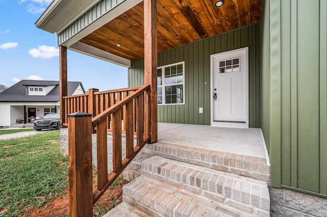 doorway to property featuring covered porch