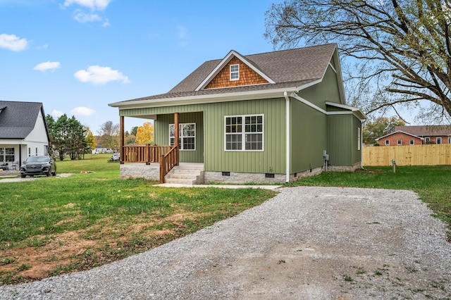 view of front facade with a front lawn and covered porch