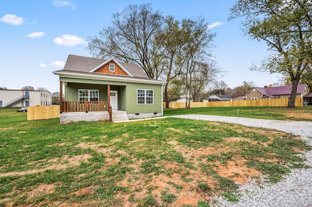 view of front of property with a front yard and covered porch