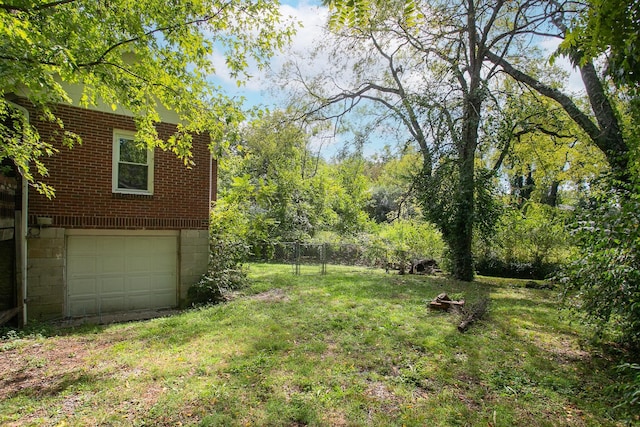 view of yard featuring a garage