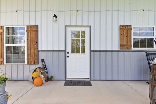 doorway to property with a patio area