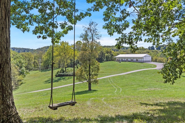 view of property's community featuring a yard