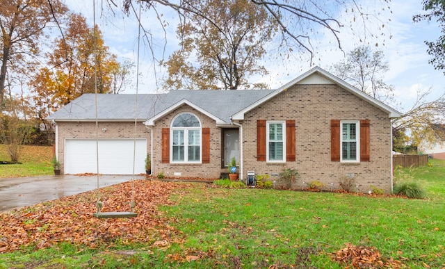 ranch-style home featuring a garage and a front lawn