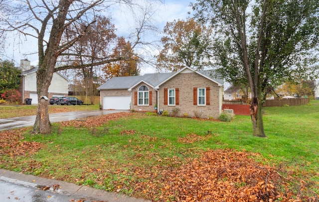 view of front facade with a front yard and a garage