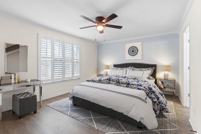 bedroom with light hardwood / wood-style flooring, ceiling fan, and ornamental molding