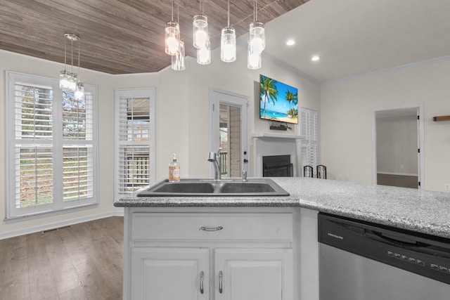 kitchen with hardwood / wood-style floors, dishwasher, white cabinetry, and a wealth of natural light