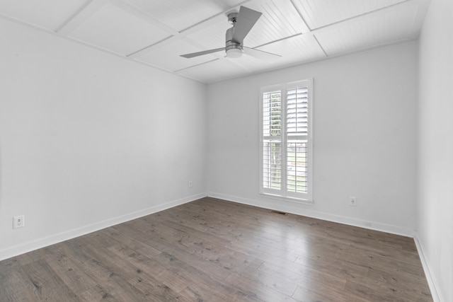 spare room with ceiling fan and dark wood-type flooring