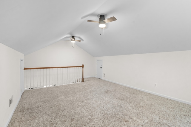 additional living space featuring carpet, ceiling fan, and lofted ceiling