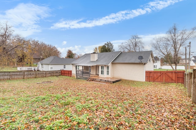 back of property featuring a deck