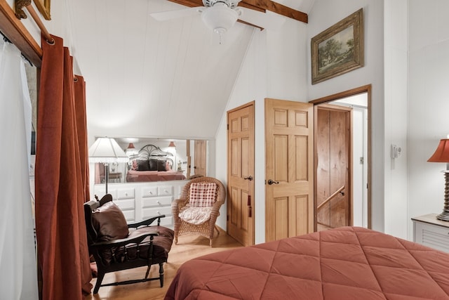 bedroom featuring wood-type flooring, ceiling fan, beamed ceiling, and high vaulted ceiling