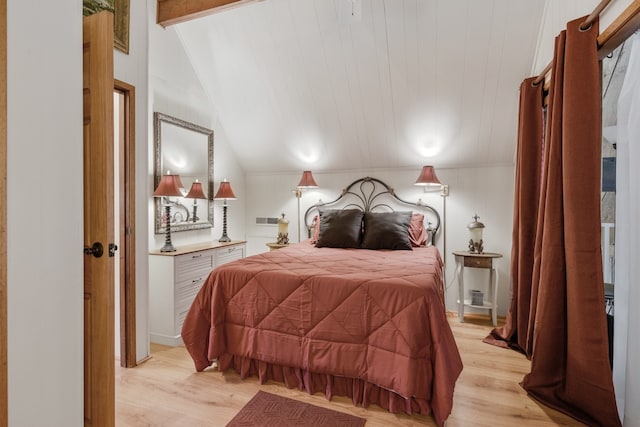 bedroom featuring lofted ceiling with beams, light hardwood / wood-style floors, and wooden ceiling