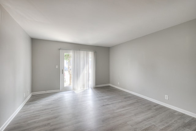 spare room featuring light wood-type flooring