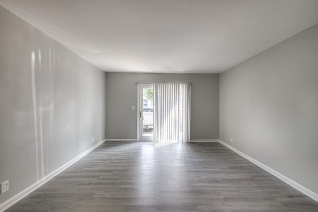 spare room with hardwood / wood-style floors